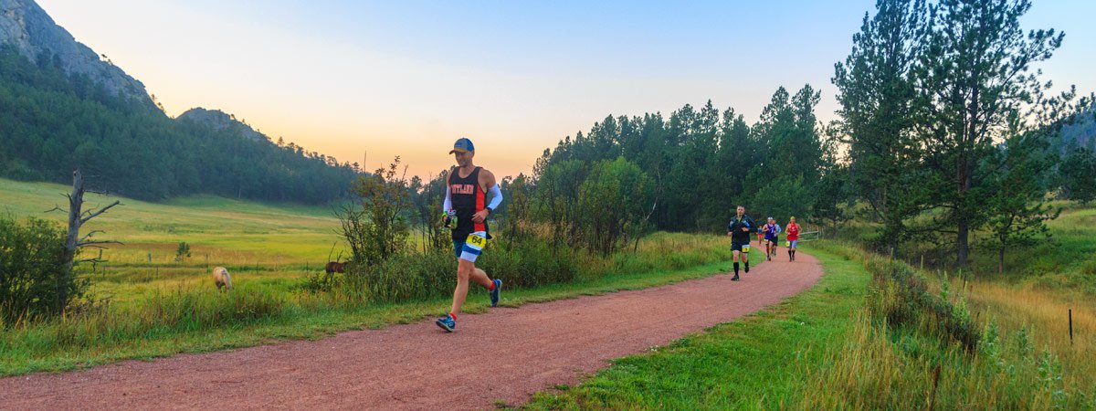 a man running on a trail